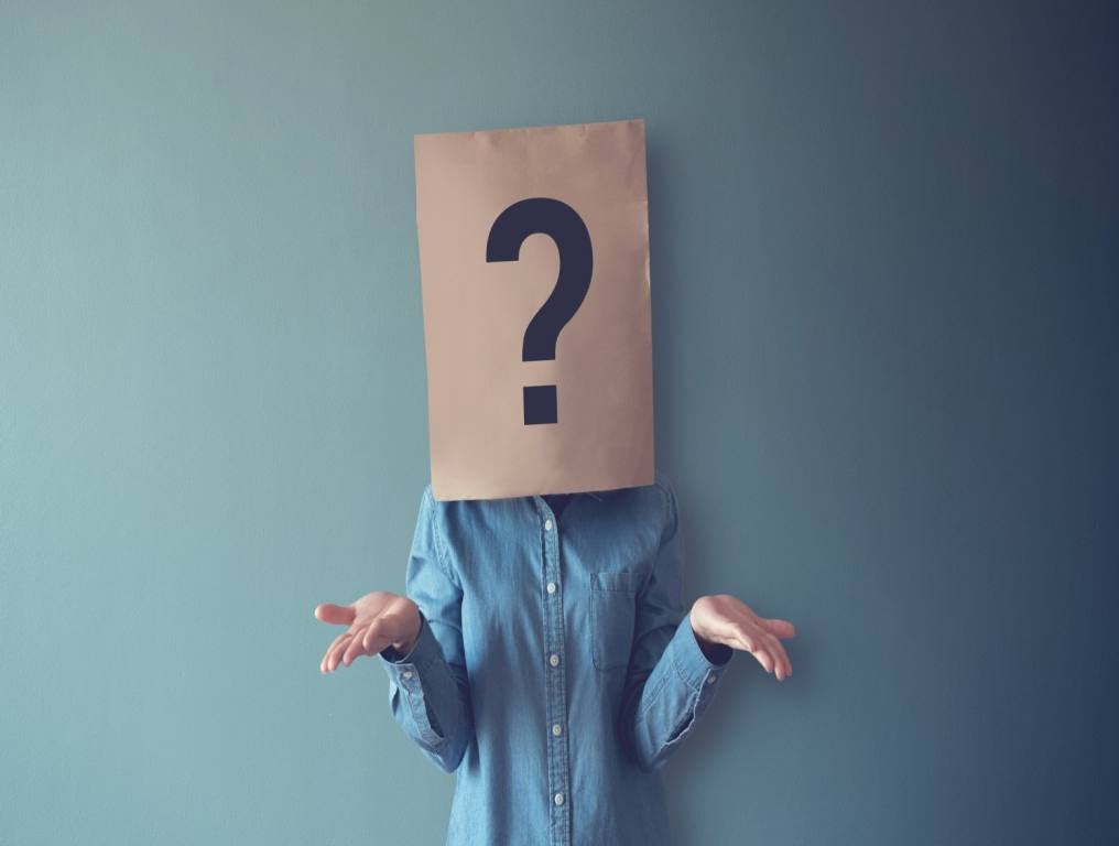 Person with a bag over their head, with a question mark on it