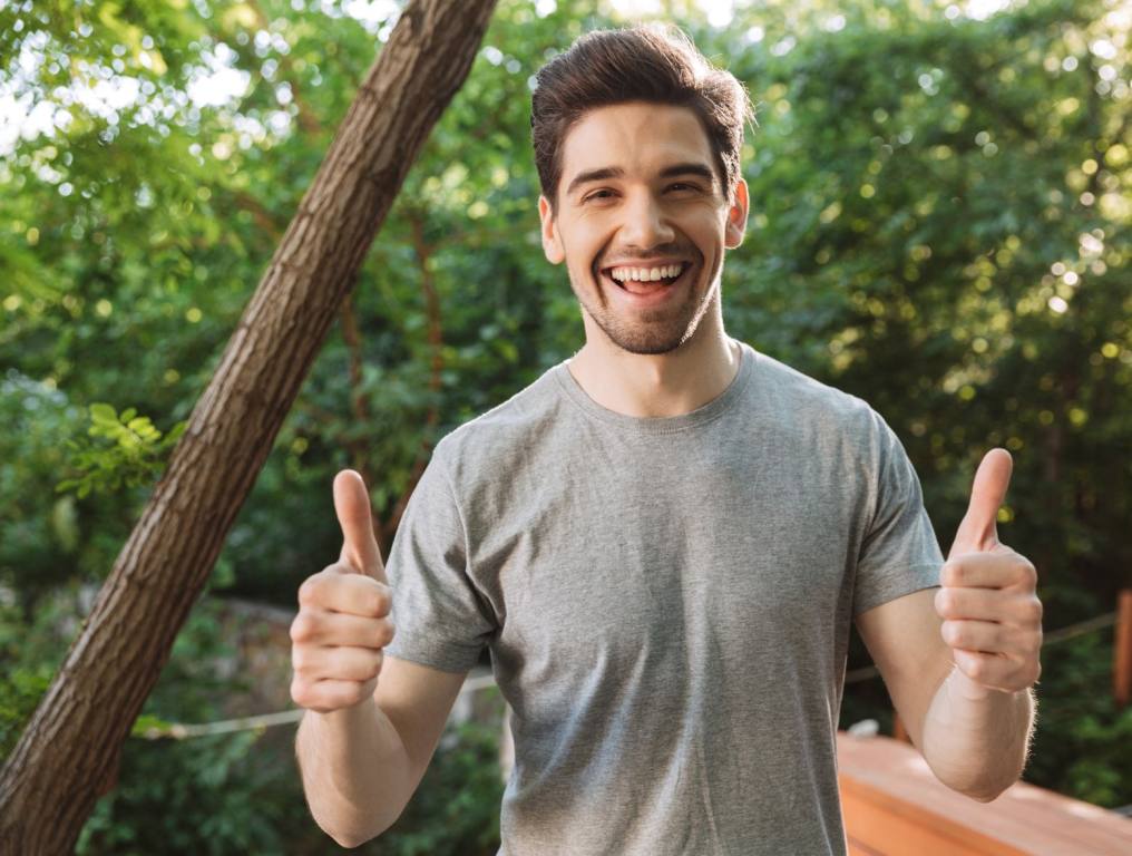 A man giving two thumbs up.