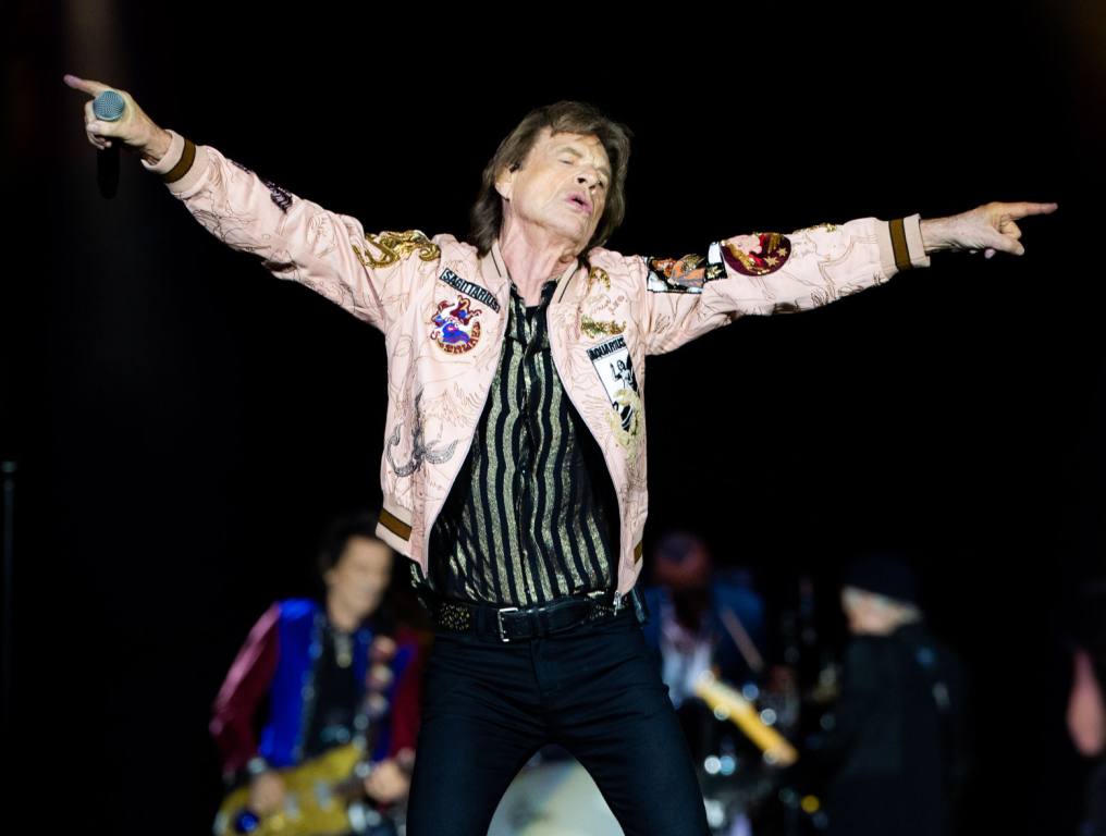 Mick Jagger dances on stage during a show.