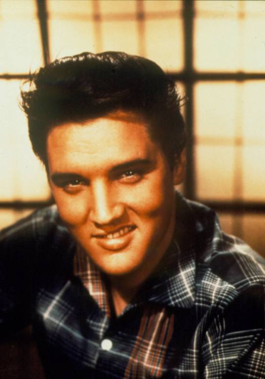 Singer Elvis Presley poses for a studio portrait.