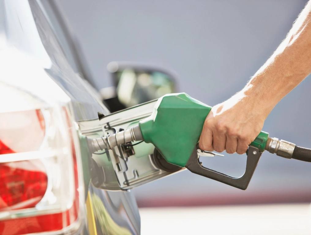 man pumping gas