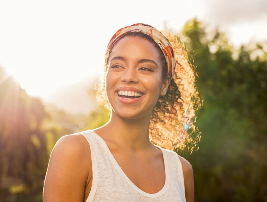 A woman laughing.