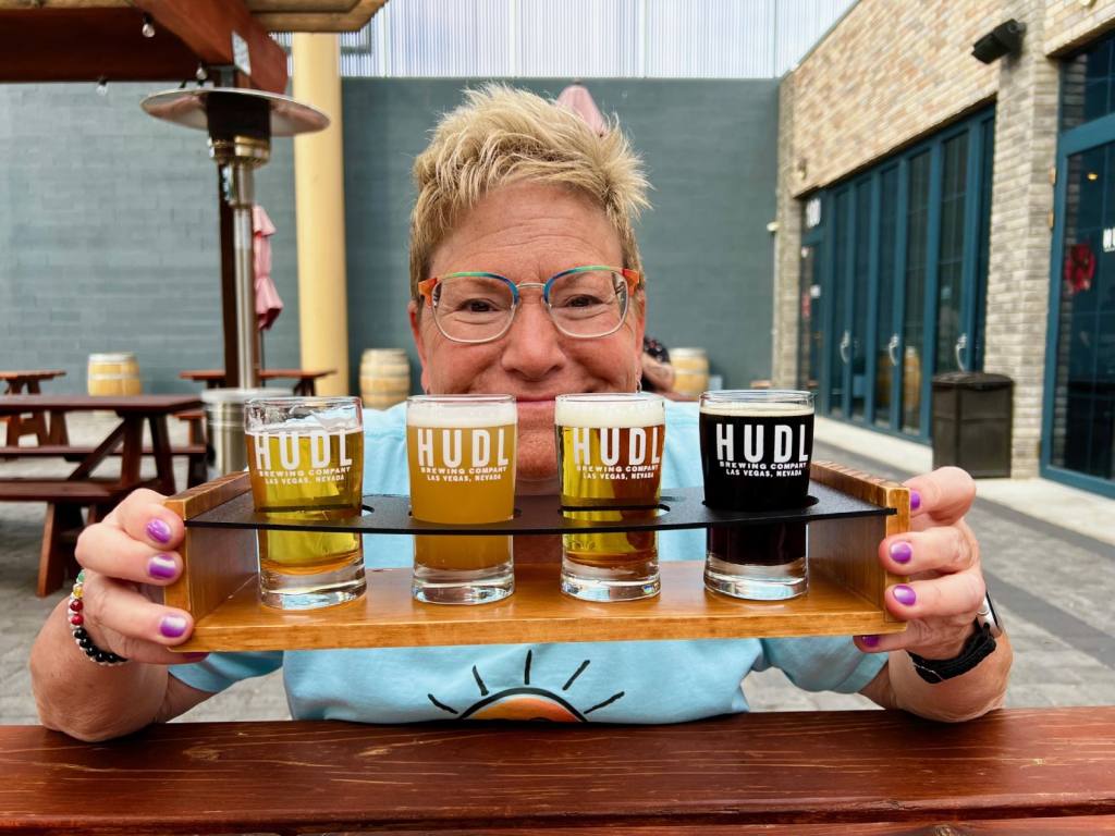 Carla Rea holds a flight of beer from HUDL Local Brewery In Las Vegas