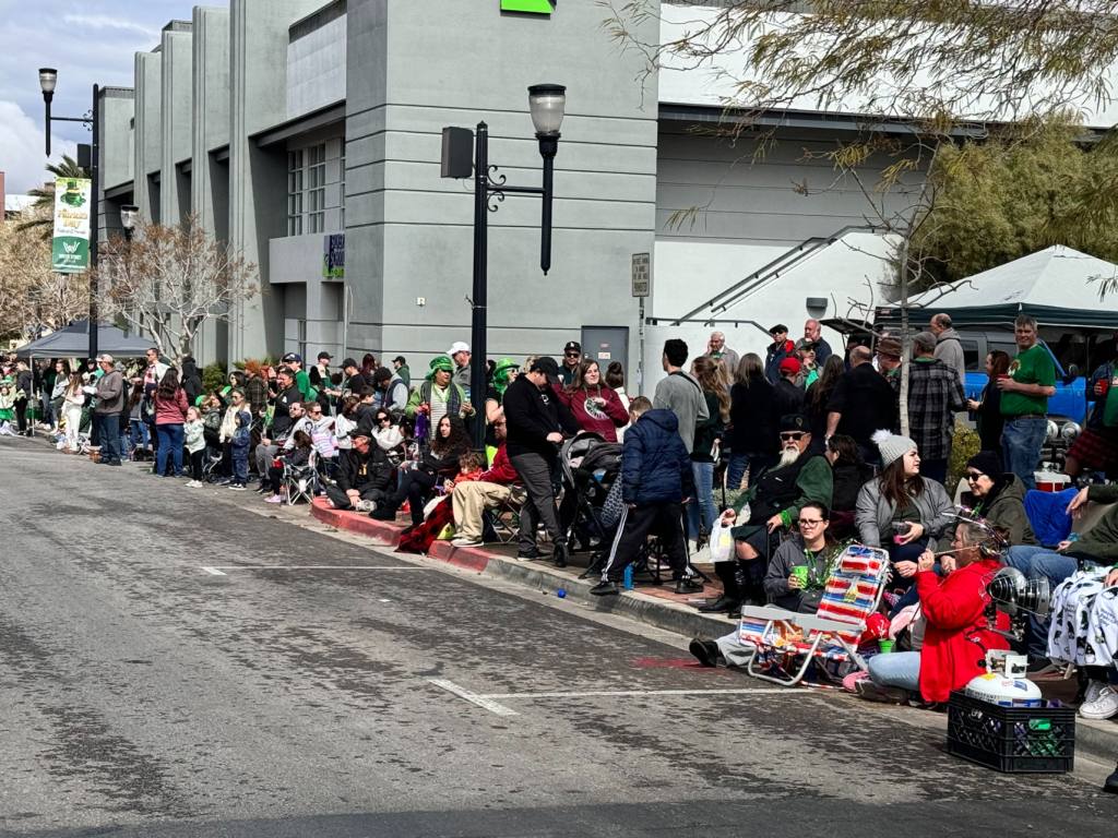 A crowd gathering at the St. Patrick's Day parade.