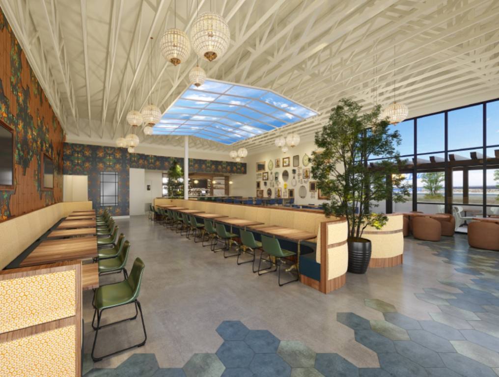 Interior shot of the Early Birds restaurant shows beige booths and floor to ceiling windows. The restaurant is not open so there are no people inside.