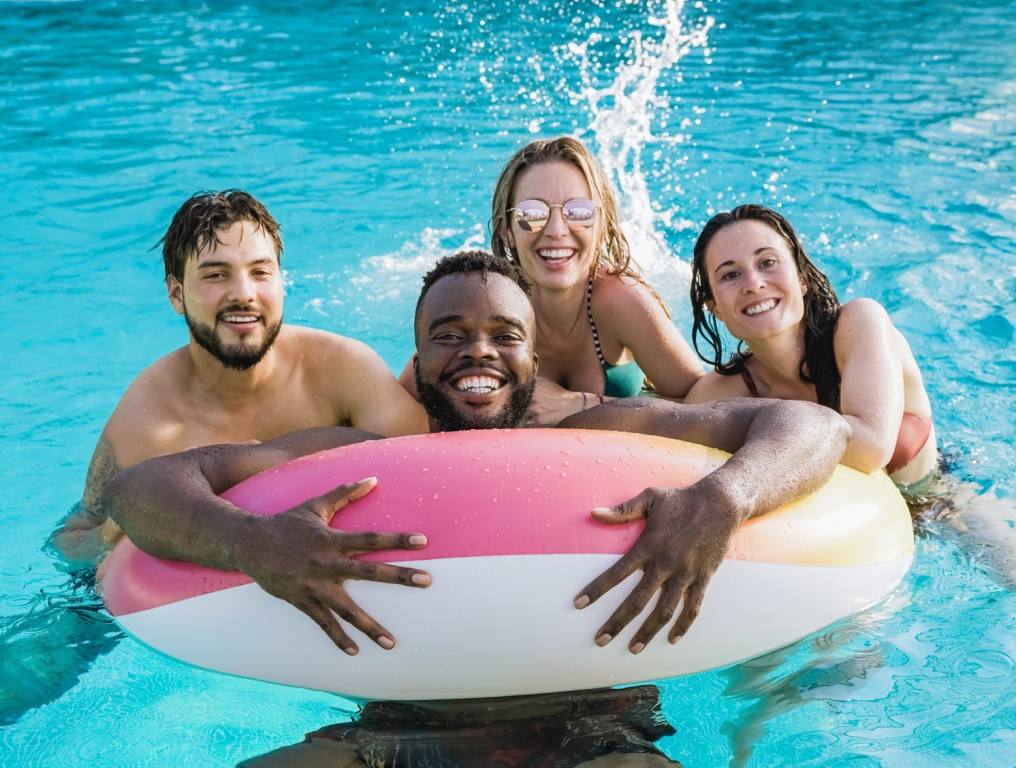 People in a pool on an air tube