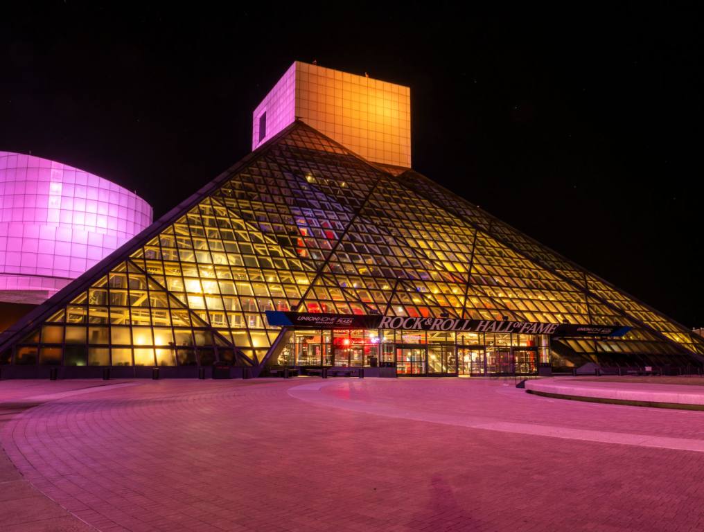 A general view of the Rock & Roll Hall Of Fame Lit in CARE Colors for International Day of The Girl at the Rock & Roll Hall of Fame and Museum on October 11, 2023 in Cleveland, Ohio.