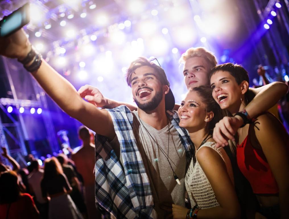 Couples taking a selfie and. having fun in clubs.