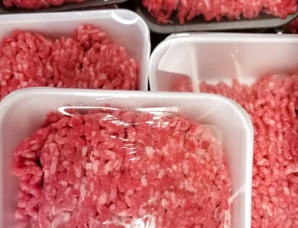 A variety of packages of ground beef at the supermarket