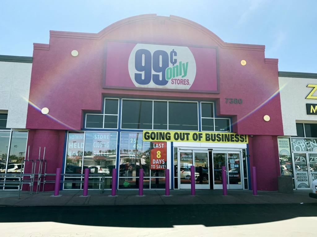 The front facade of one of the Las Vegas 99 Cents Only Stores. The wall is pink and the signage is above glass doors with a yellow "Going Out Of Business" banner displayed.