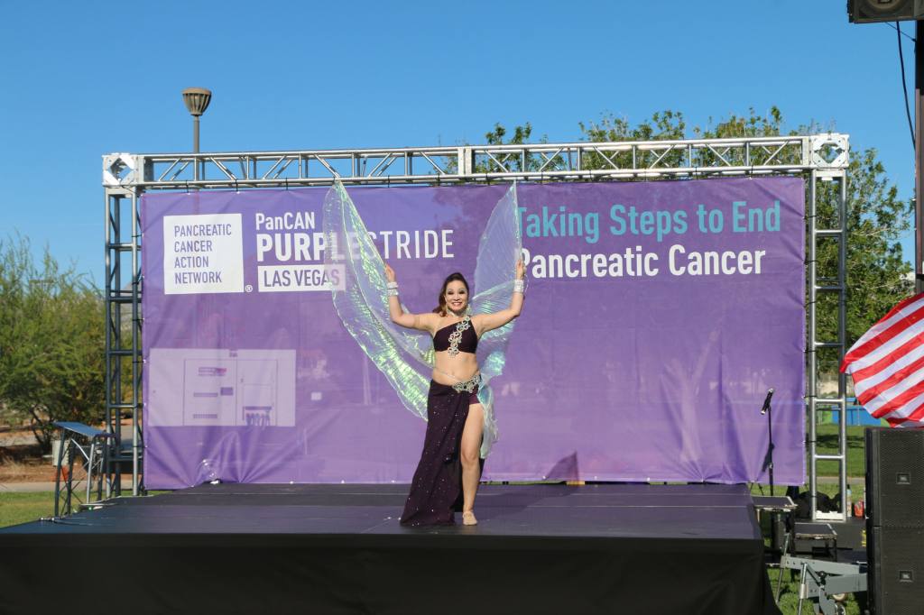 A bell dancer showcases clear wings that look similar to a butterflies.