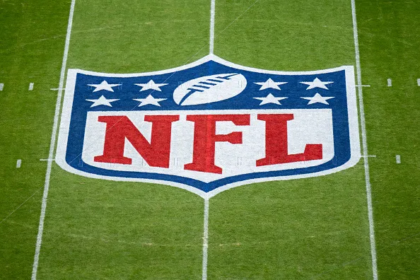 NFL logo painted on a football field. When will the NFL Schedule be released?