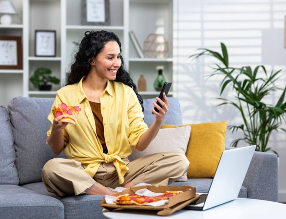 woman ordered food online using app on phone, satisfied with fast delivery.