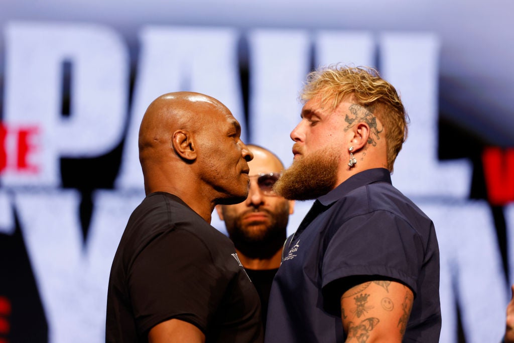 Mike Tyson and Jake Paul speak onstage at the press conference in promotion for the upcoming Jake Paul vs. Mike Tyson boxing match at The Apollo Theater. Here's what to know about the Mike Tyson vs. Jake Paul fight.