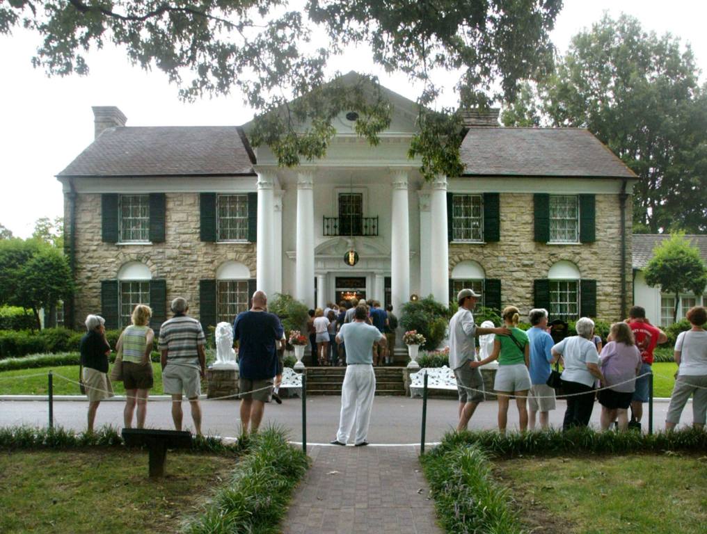 Fans line up to view Elvis Presley's Graceland home during Elvis Week on August 12, 2002 in Memphis, Tennessee. 75,000 fans are expected to attend the celebration of all things Elvis which this year marks the 25th anniversary of Presley's August 16, 1977 death.