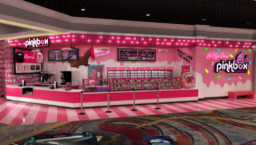 A doughnut shop in a casino has pink striped flooring and pink wallpaper.