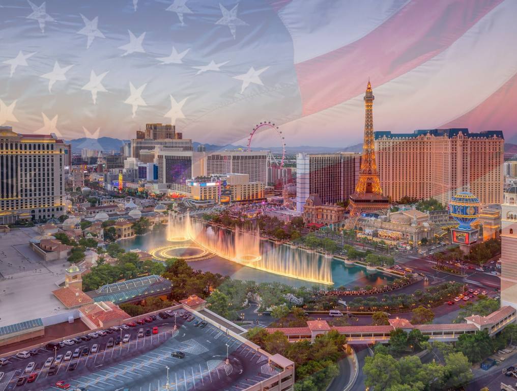 The skyline of Vegas with an American flag graphic.