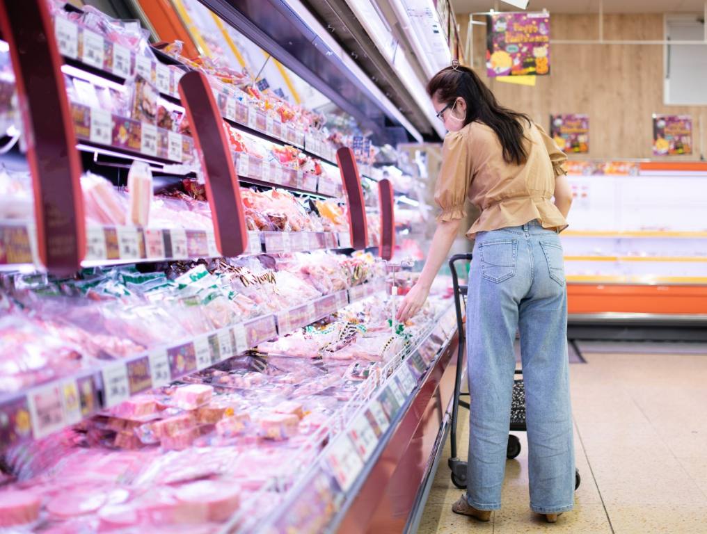 A woman in a grocery aisle