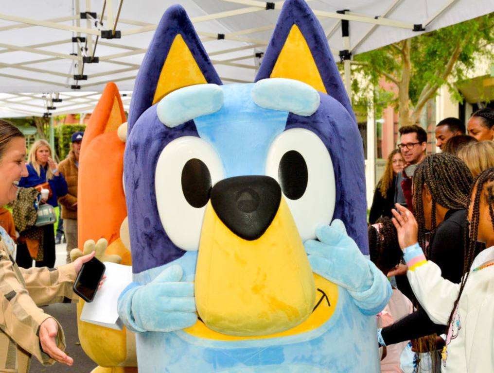 A photo of Bluey at an event. This story is about Las Vegas hot dog restaurant, "Dirt Dog," hosting a Bluey Day that failed and left many parents upset.