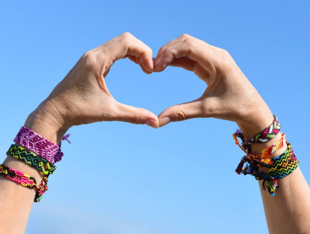 heart hands with friendship bracelets