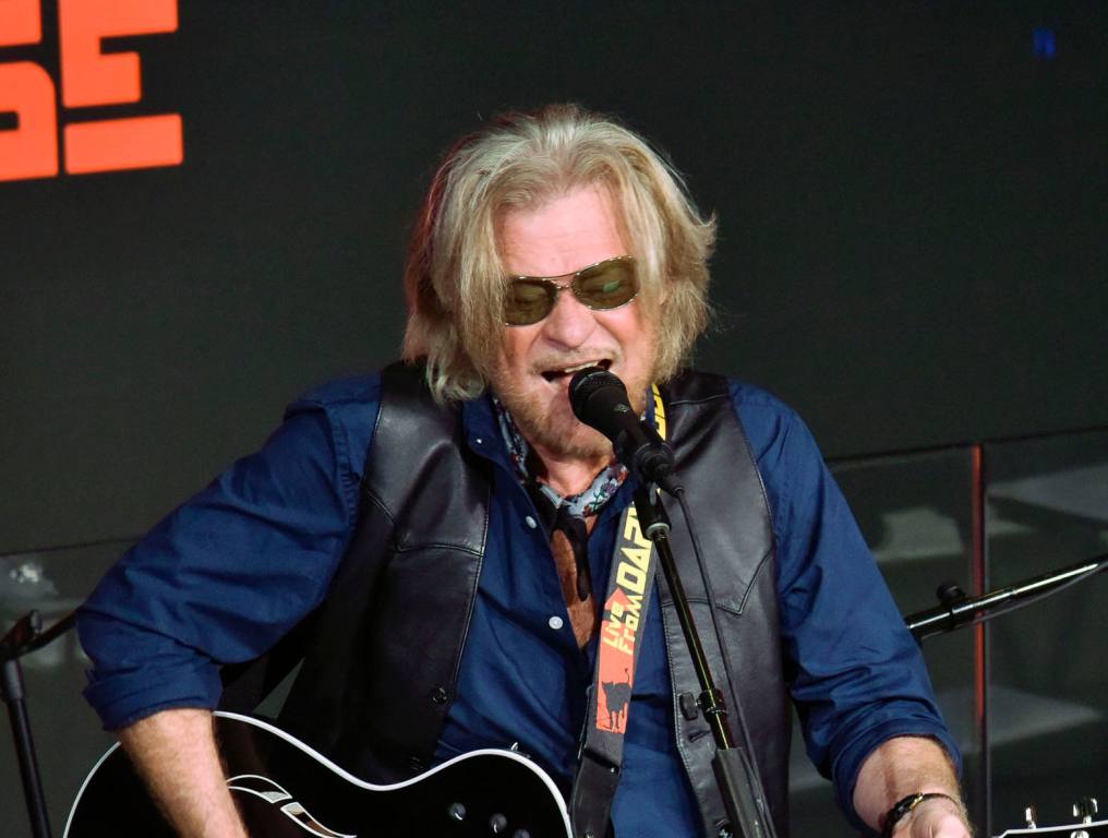 Daryl Hall performing on stage.