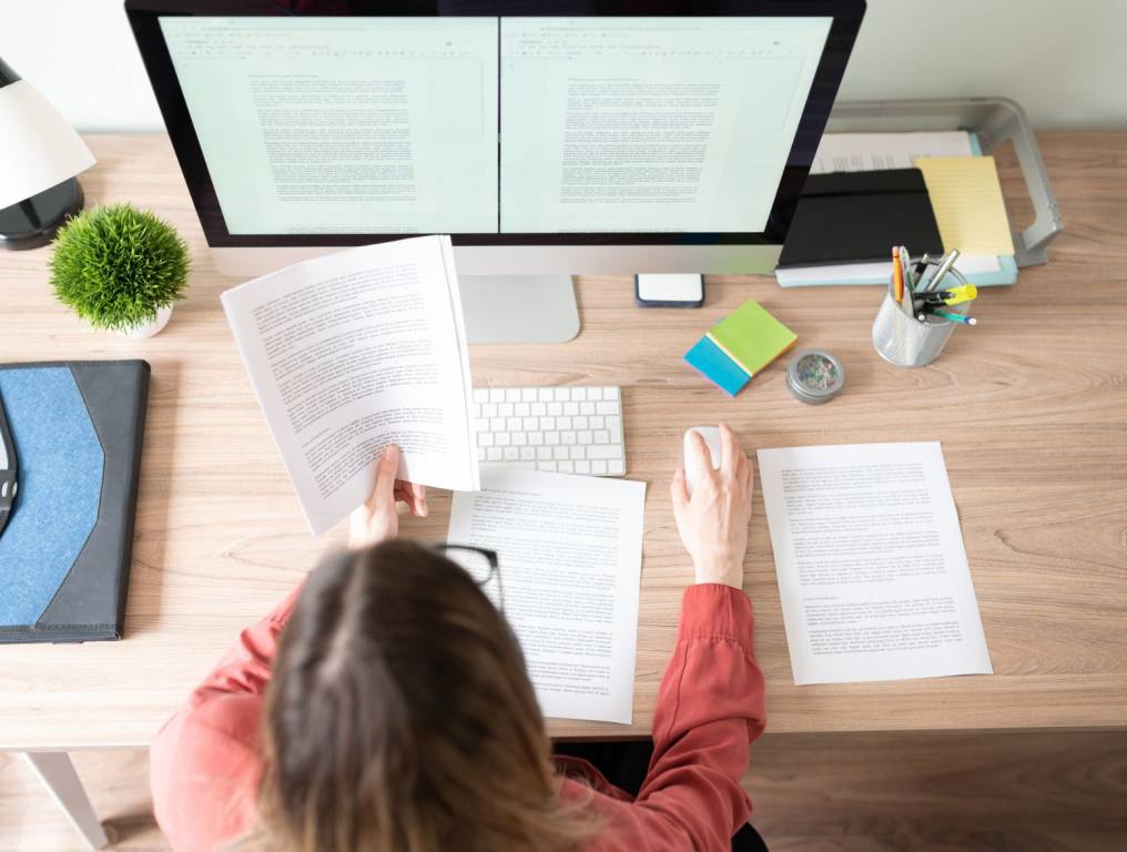 A woman editing a paper.