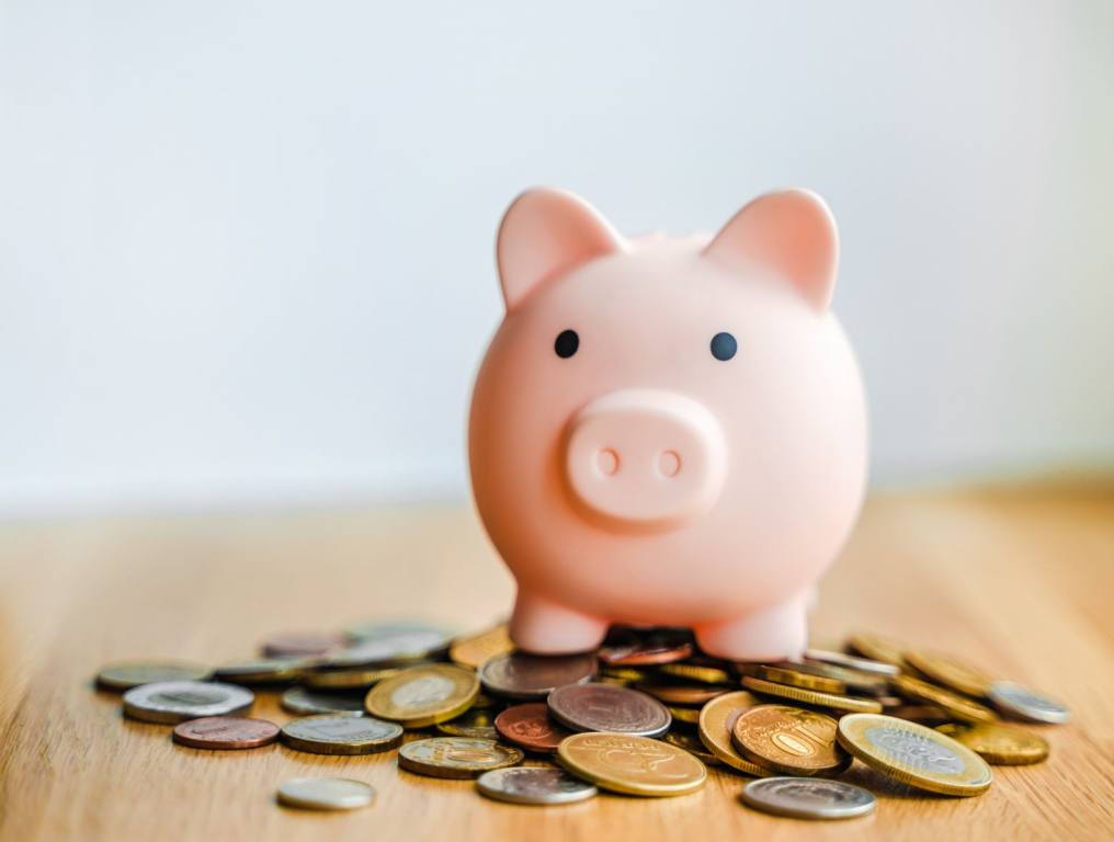 A piggy bank with savings. If you've ever wanted to compare your savings to the average savings of those in your age group, we have the numbers and research.