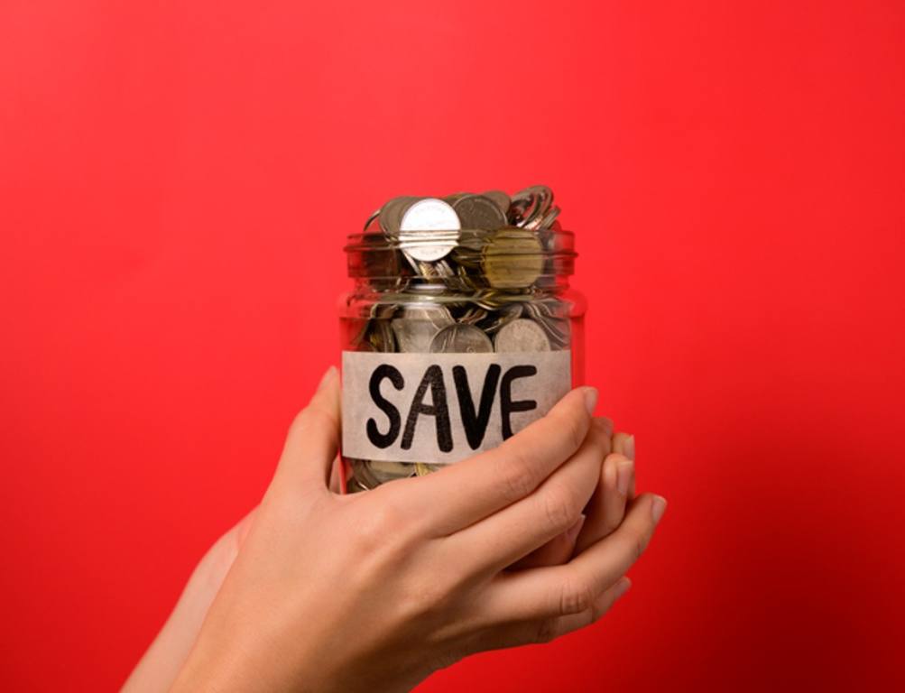 Hand holding coins in glass jar, Financial business investment, Growing money, People saving money, Money for future, Money saving concept