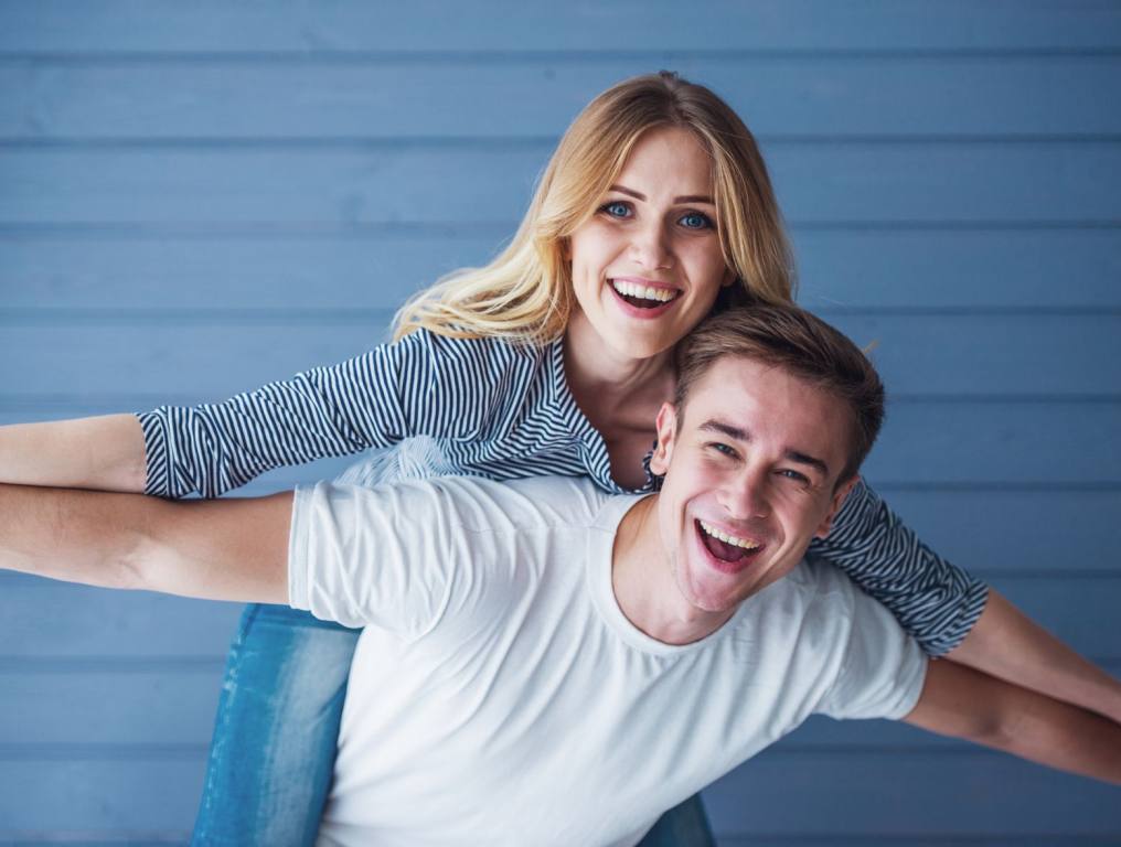 A man and woman smiling. There's a simple activity, once a month, that can lengthen your life, according to experts.