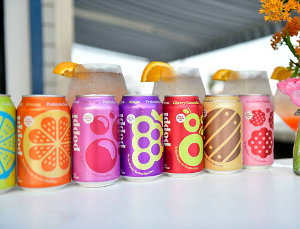 Poppi soda can displayed on table in beachy area