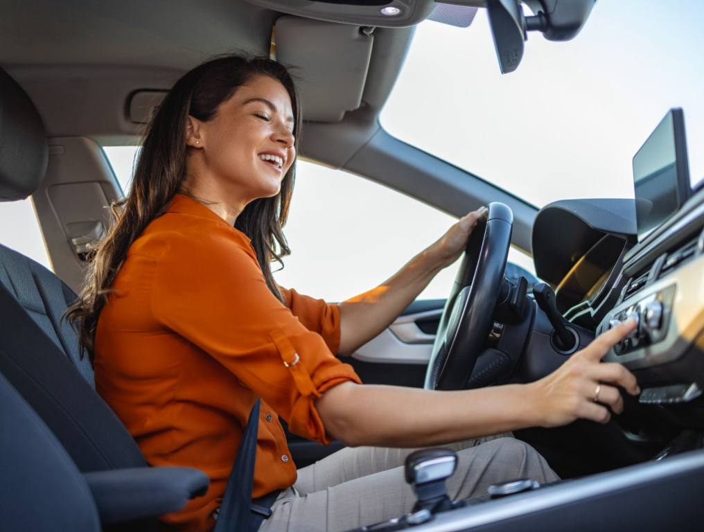 A woman driving a car.