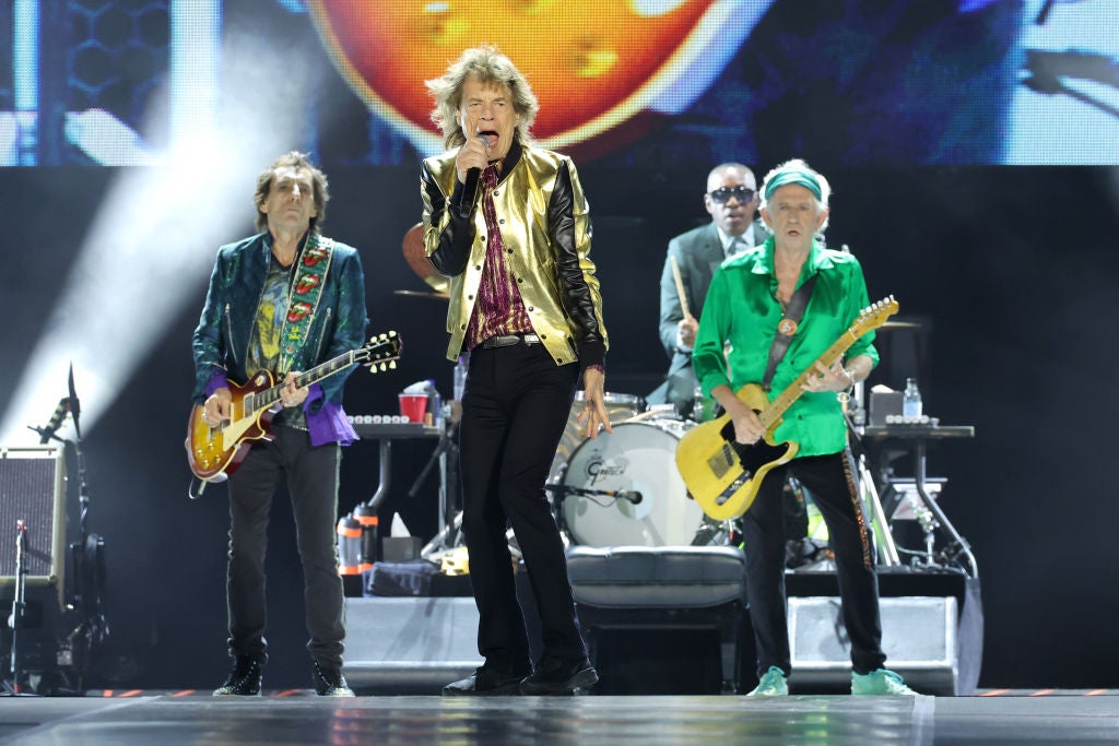 Mick Jagger, Keith Richards and Ronnie Wood of the Rolling Stones on stage with drummer Steve Jordan.