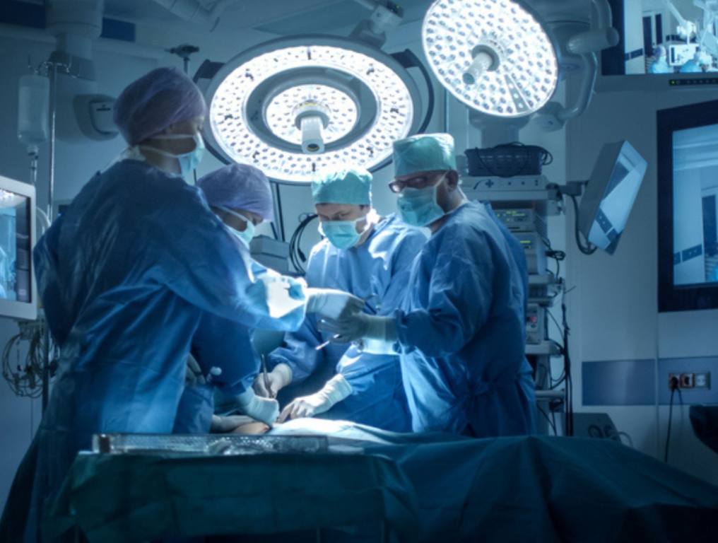 Medical Team Performing Surgical Operation in Modern Operating Room