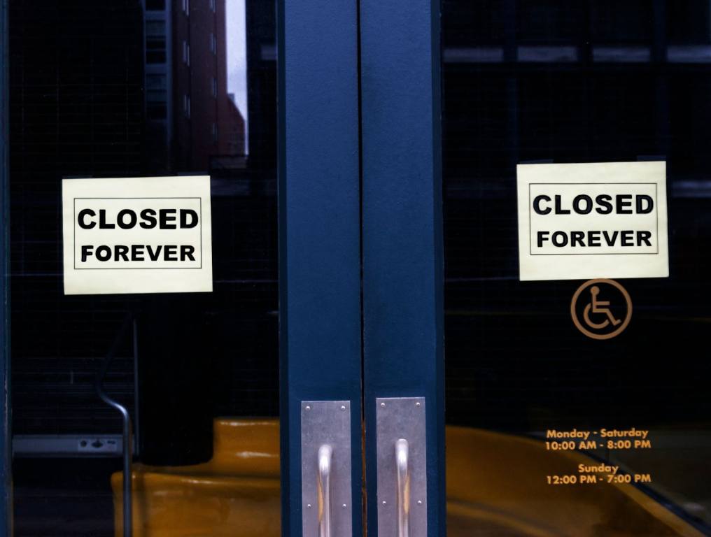 The Sundry a food hall in Las Vegas announced plans to close its doors. This photo is blue doors with a sign in the door windows that says, "closed forever."