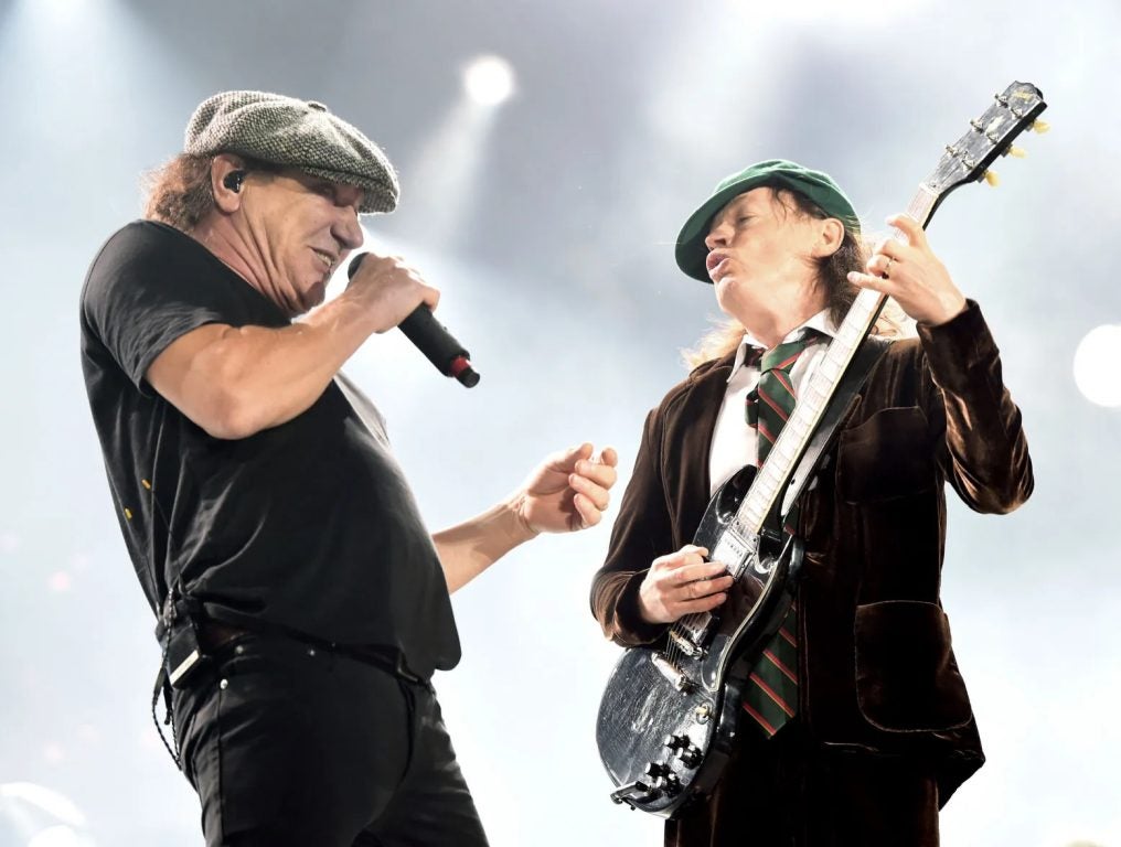 Brian Johnson and Angus Young of AC/DC perform at Dodger Stadium on September 28, 2015 in Los Angeles, California.