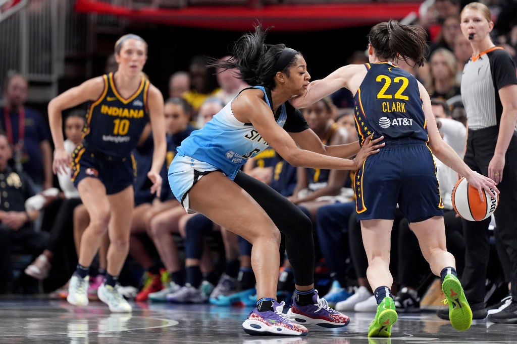 Angel Reese #5 of the Chicago Sky fouls Caitlin Clark #22 of the Indiana Fever during the second half at Gainbridge Fieldhouse. Caitlin Clark and Angel Reese are going to take on the Olympics Team USA in a much-anticipated game.