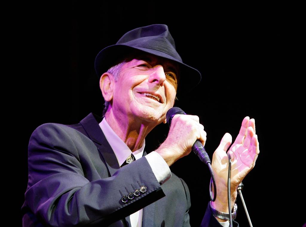 Leonard Cohen performing on stage