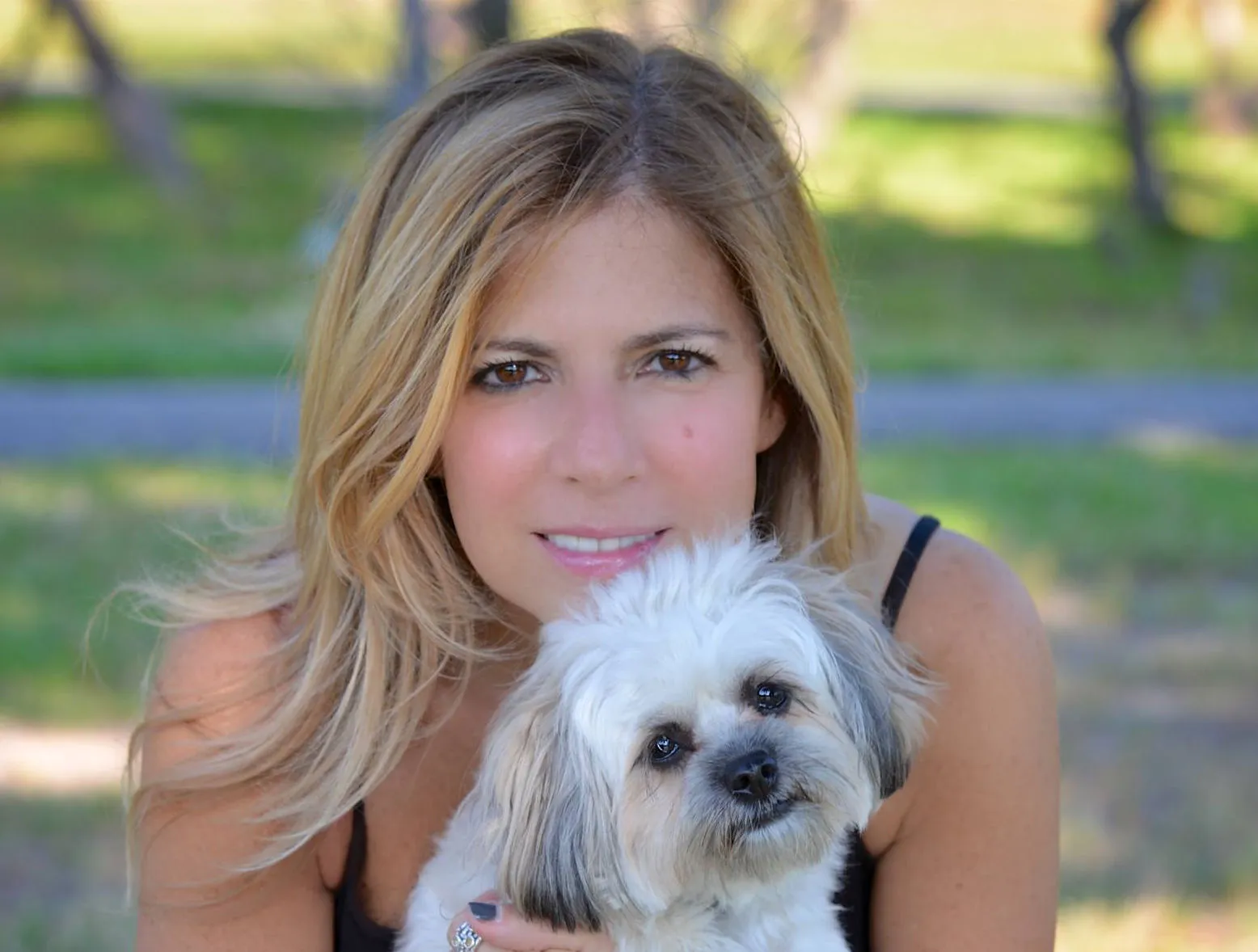 Terrie Carr with a cute little white dog