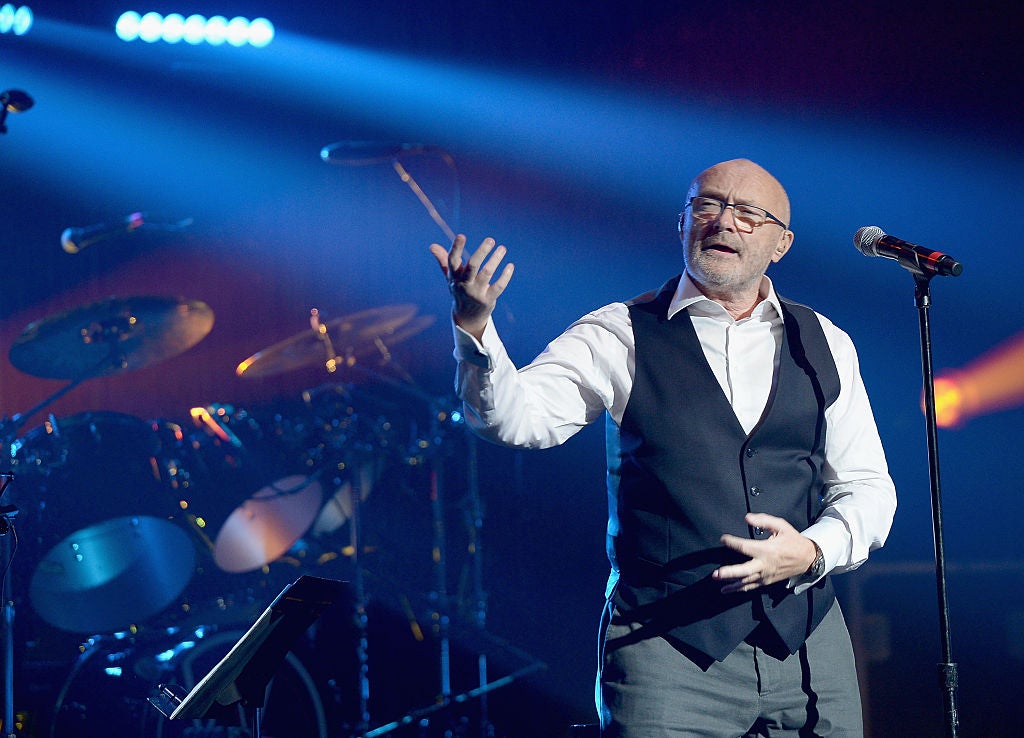 Phil Collins singing on stage