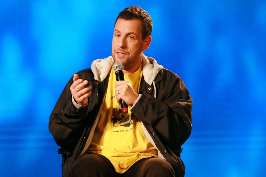 Adam Sandler giving an interview in comfortable clothing. Adam Sandler Is An Unexpected Gen Z Fashion Icon