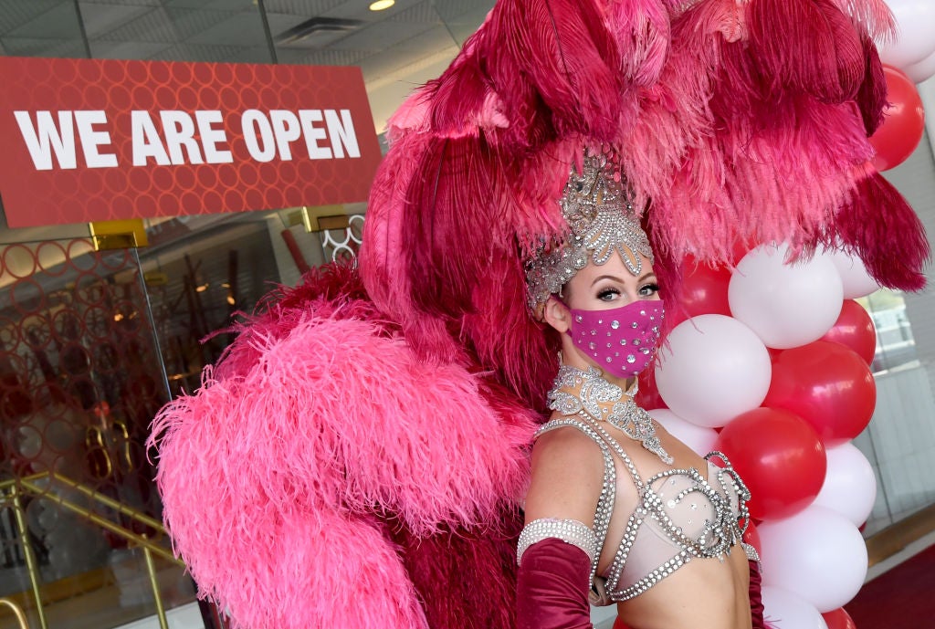 A Vegas showgirl in front of the Tropicana