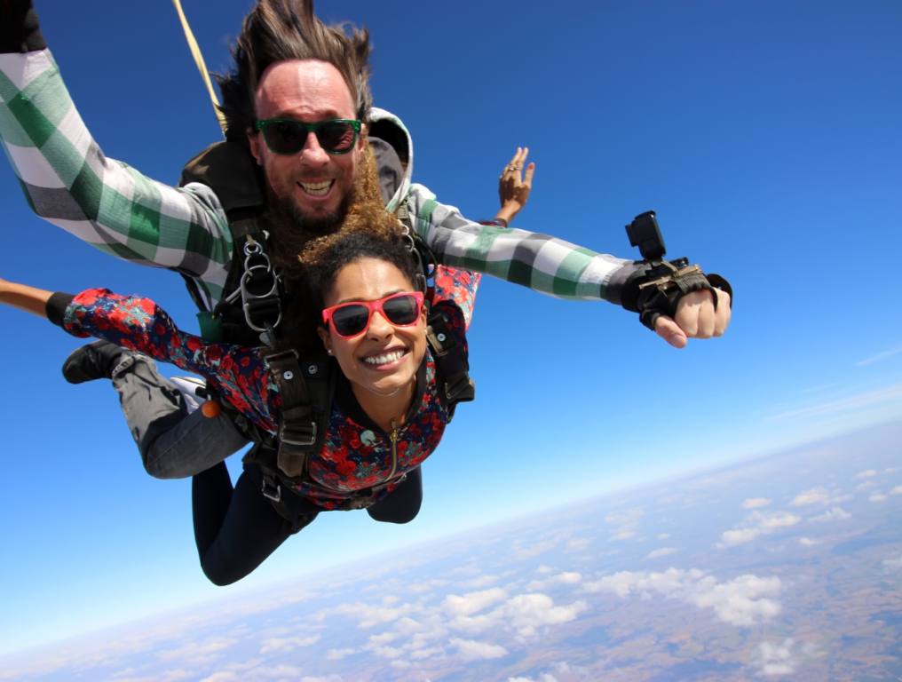 A couple taking the adventure of a lifetime and skydiving.