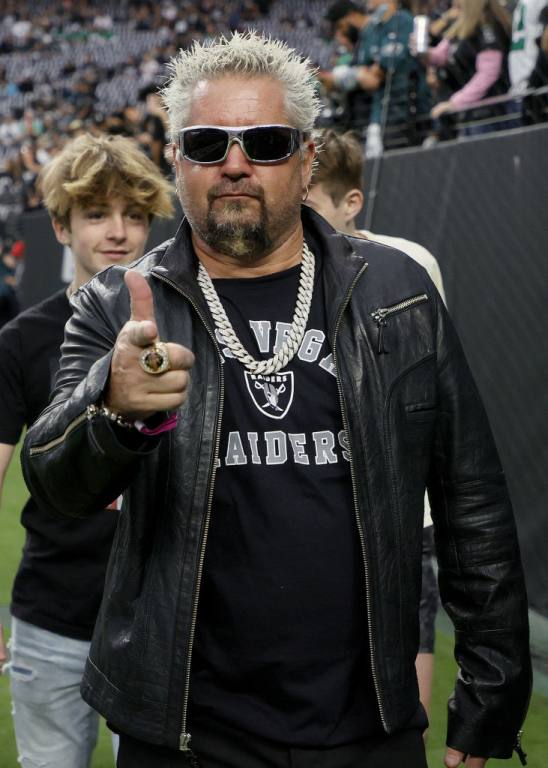 American restaurateur Guy Fieri enjoys himself at Allegiant Stadium during an epic home game.