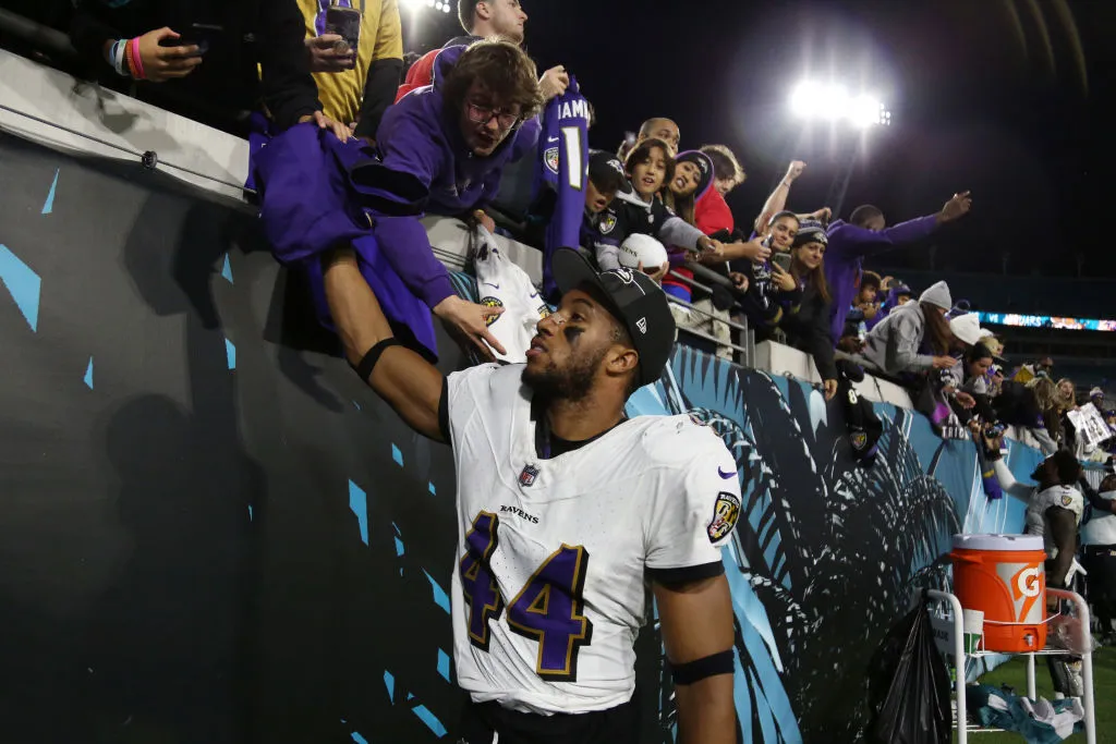 Marlon Humphrey #44 of the Baltimore Ravens high fives with fans following his team's victory against the Jacksonville Jaguars at EverBank Stadium. One NFL player has criticized Biles and fellow Olympian Jordan Chiles for a move they made in good will, and people are certainly taking Biles and Chiles' side.