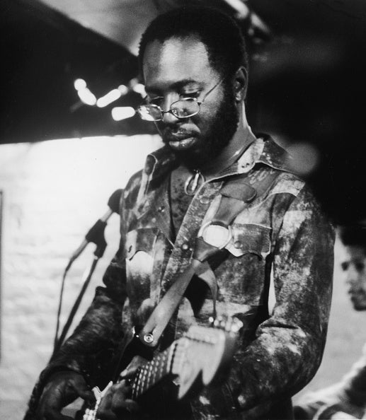 Curtis Mayfield (1942 - 1999) plays his electric guitar, early 1972.