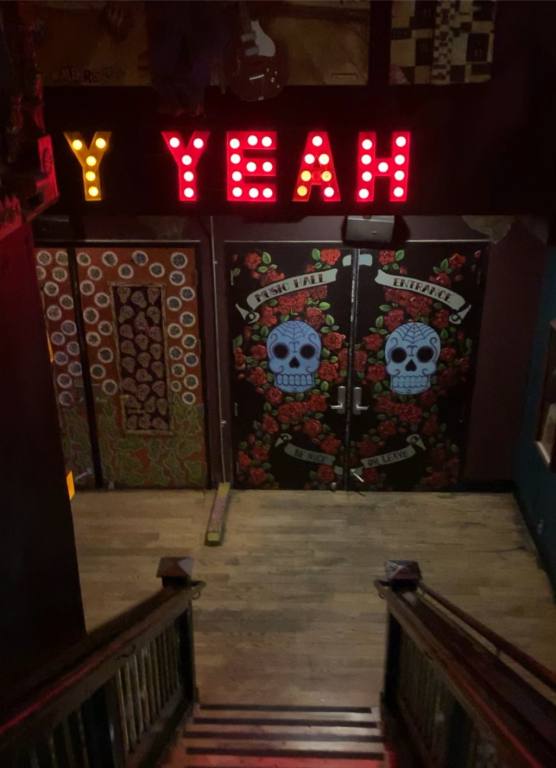 Stairs leading down to the doors to the House of Blues Las Vegas Music Hall.