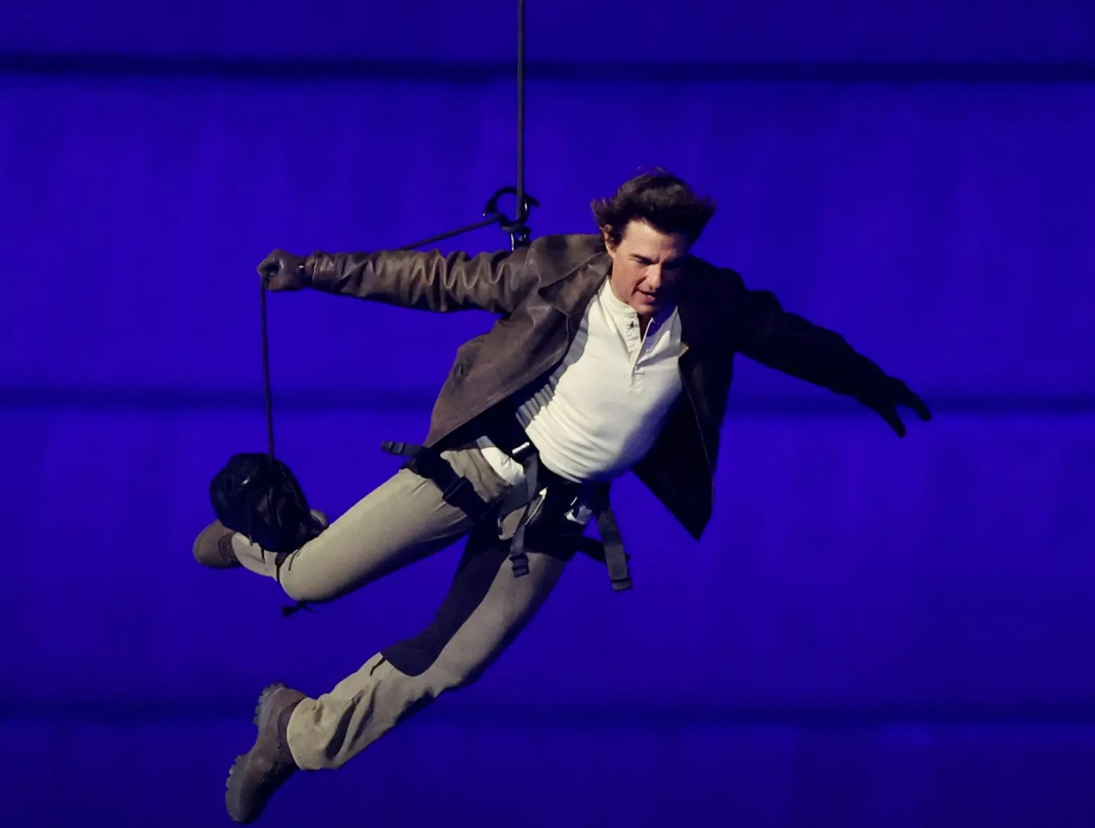 Tom Cruise jumps from the roof of the Stade de France during the Closing Ceremony of the Olympic Games Paris 2024 at Stade de France on August 11, 2024 in Paris, France.