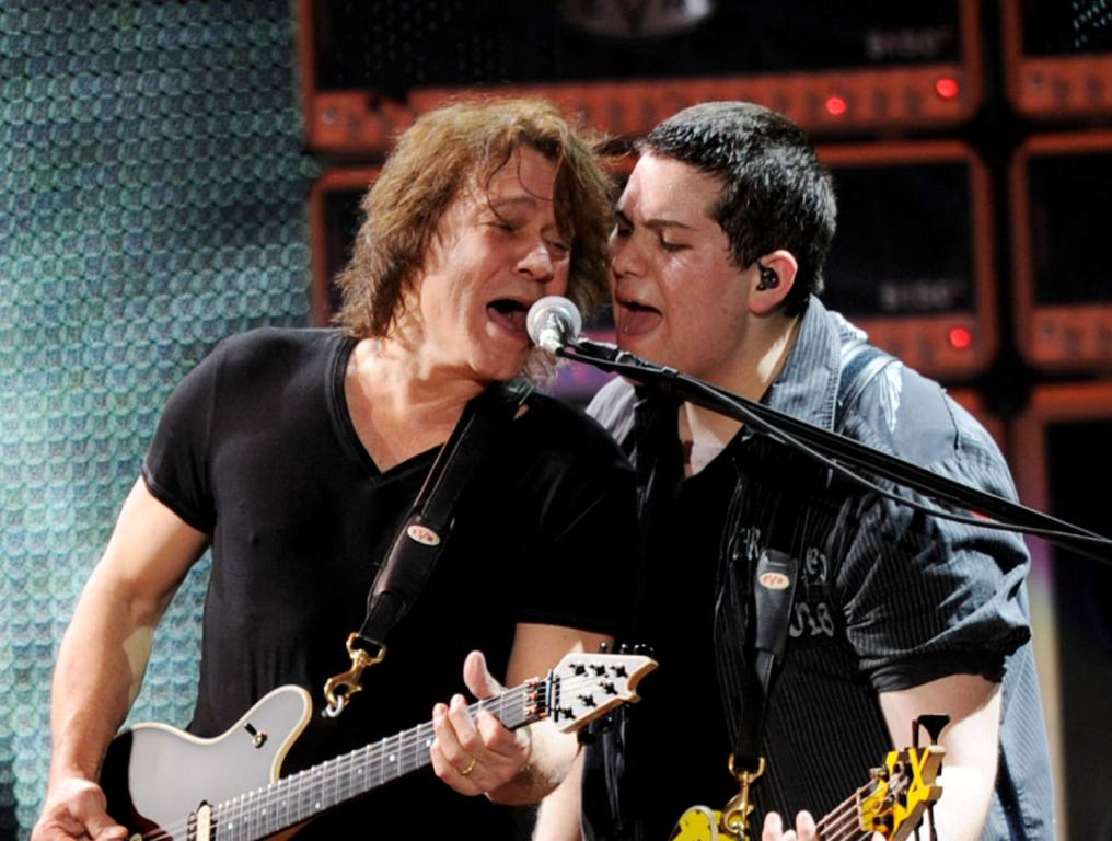 Eddie Van Halen (L) and Wolfgang Van Halen of Van Halen perform at their dress rehearsal for family and friends at the Forum on February 8, 2012 in Inglewood, California.