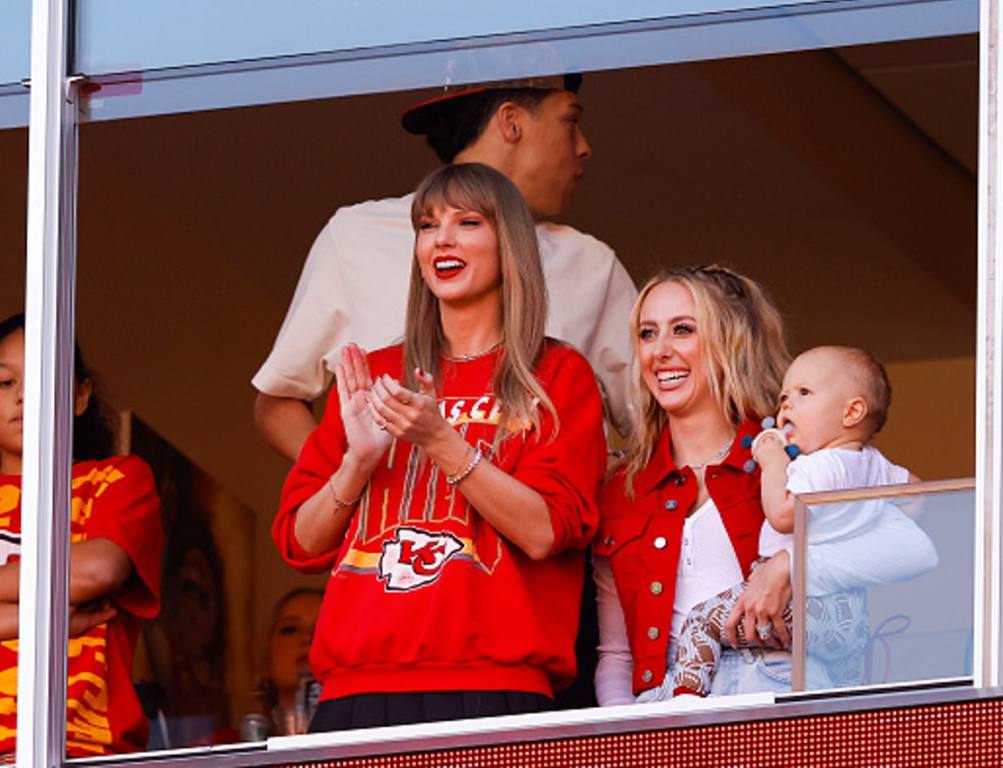 Taylor Swift and Brittany Mahomes look on during a game between the Los Angeles Chargers and Kansas City Chiefs at GEHA Field at Arrowhead Stadium