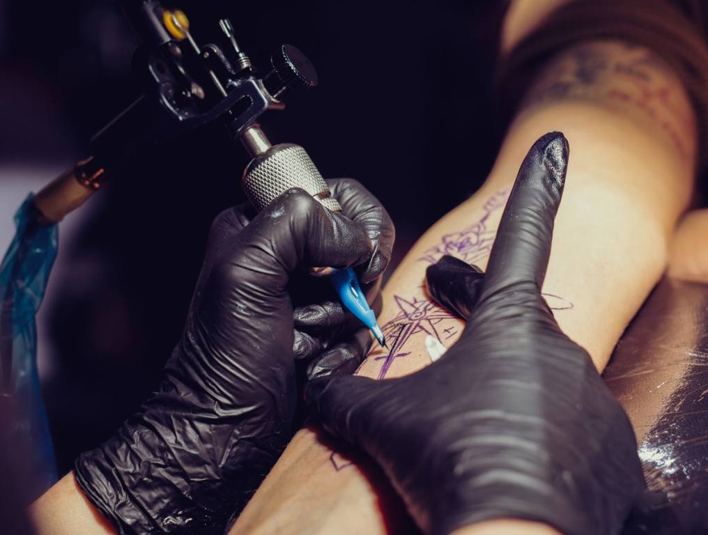 A person getting their arm tattooed. This story is about Friday the 13th Tattoo Deals in Las Vegas.